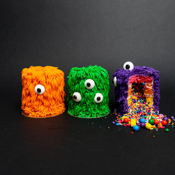 Green, Orange and Purple mini cakes with monster chocolate eyes