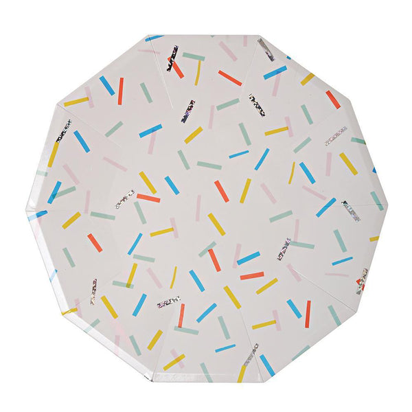 Decagon shaped white plate with rainbow sprinkles and silver foil embellishments